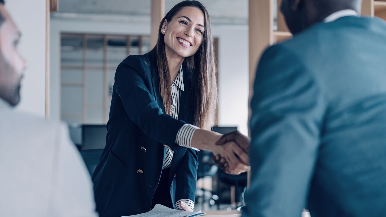 Business people shaking hands in the office LARGE